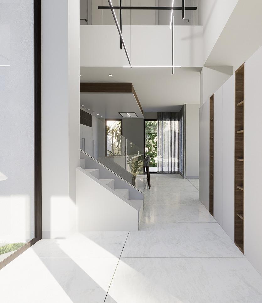 Bright, modern open-plan interior with sleek staircase and floor-to-ceiling windows in luxury 4-bedroom villa, La Zenia, Orihuela Costa.