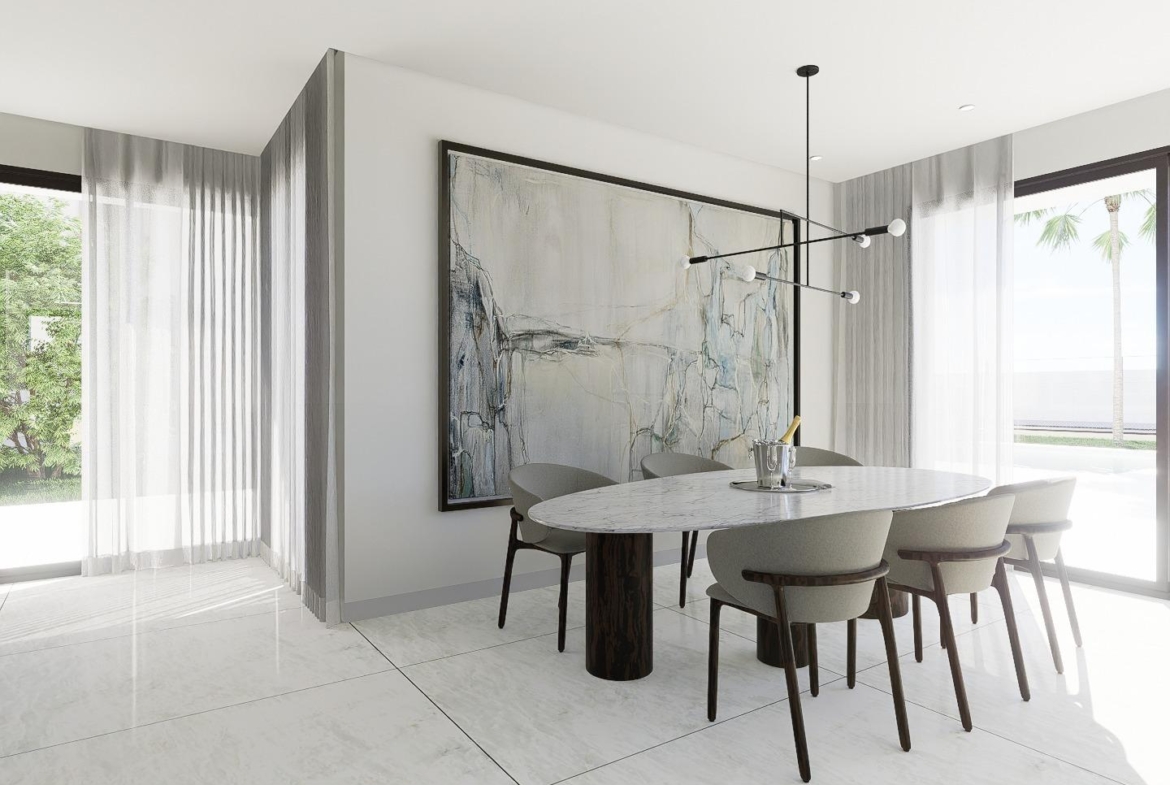 Elegant, bright dining area with modern furnishings and large windows overlooking the landscaped exterior of the luxury 4-bedroom villa in La Zenia.