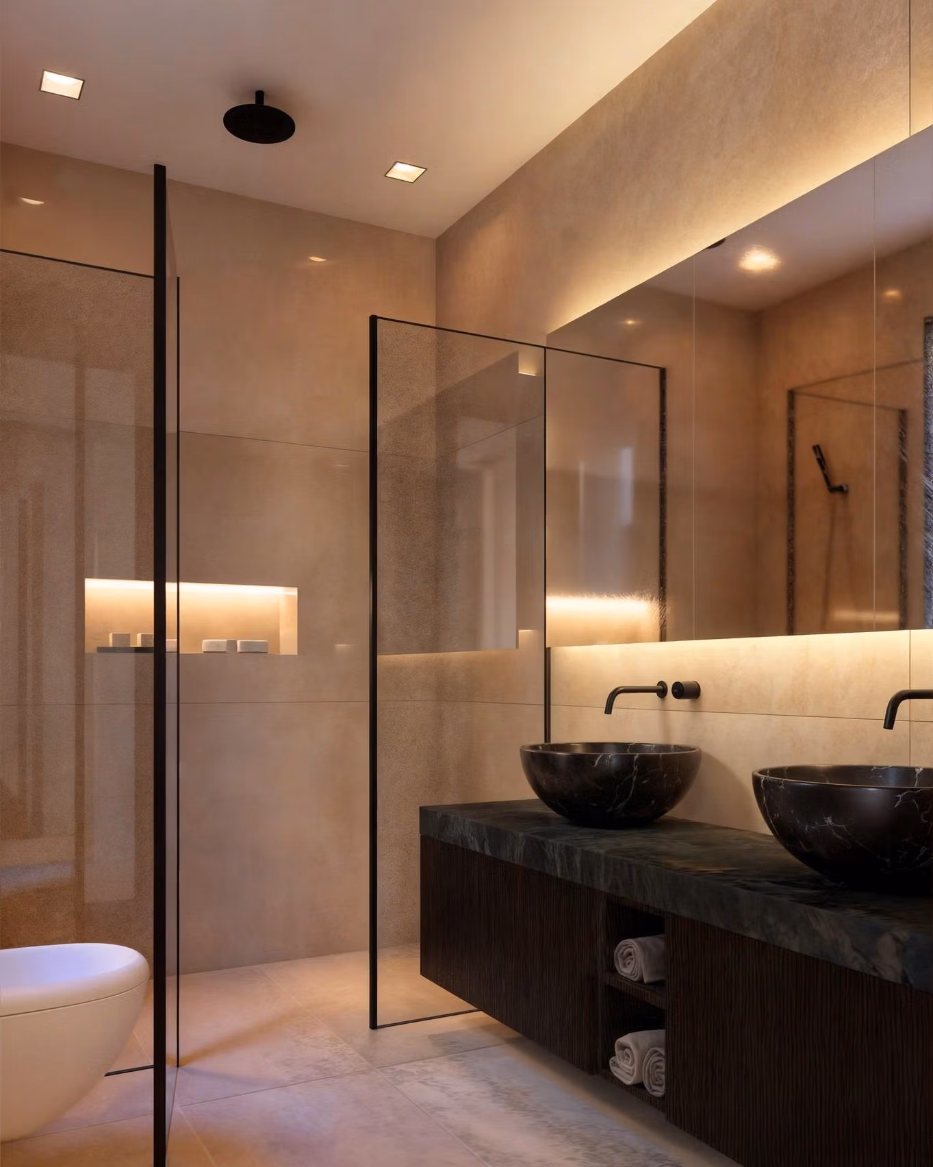 Modern, elegant bathroom with black stone sinks and ambient lighting in a luxury 4-bedroom villa in Benissa Costa.