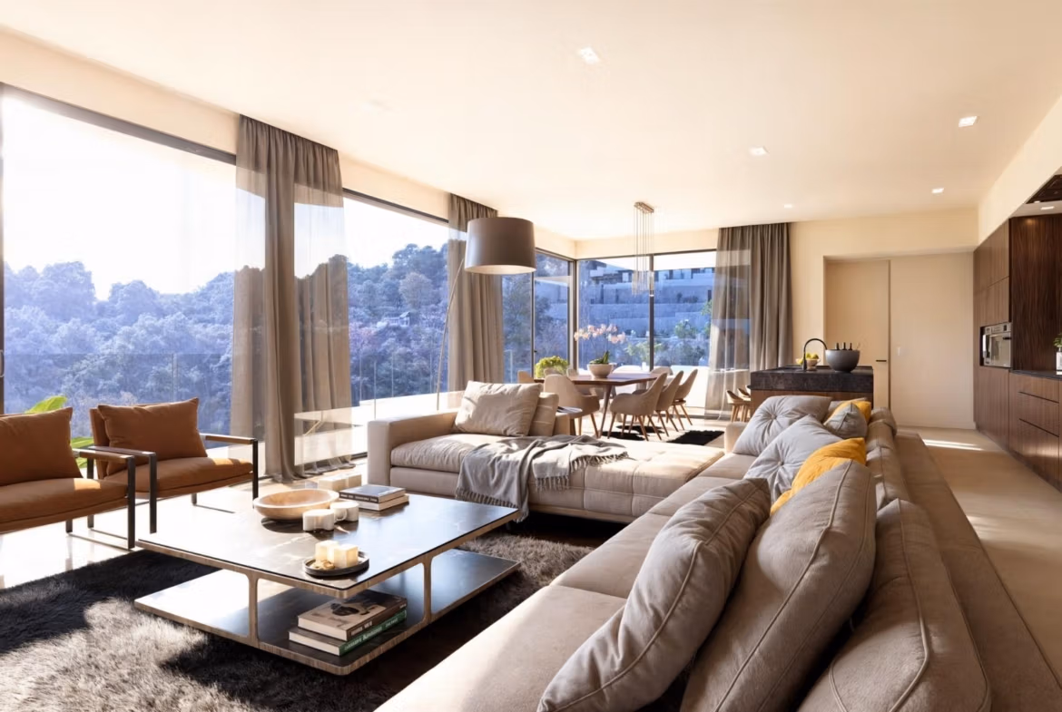 Spacious sun-drenched living and dining area with modern elegance and forest views in luxury 4-bedroom villa, Benissa Costa