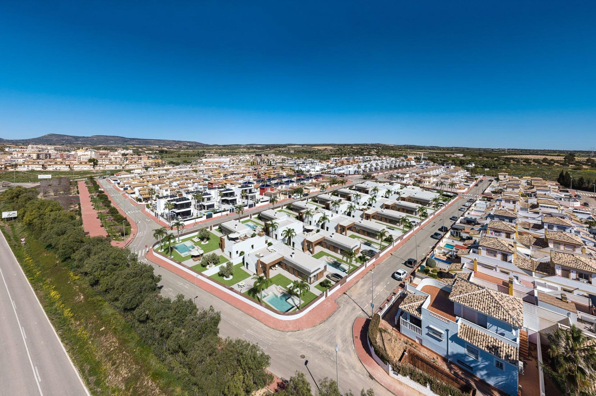 Luxury-New-Build-Villas-in-Sucina-with-Private-Pool-and-Large-Plots-1 Panoramic aerial view of modern luxury new build single-storey villas with private pools in sun-drenched Sucina, Murcia.