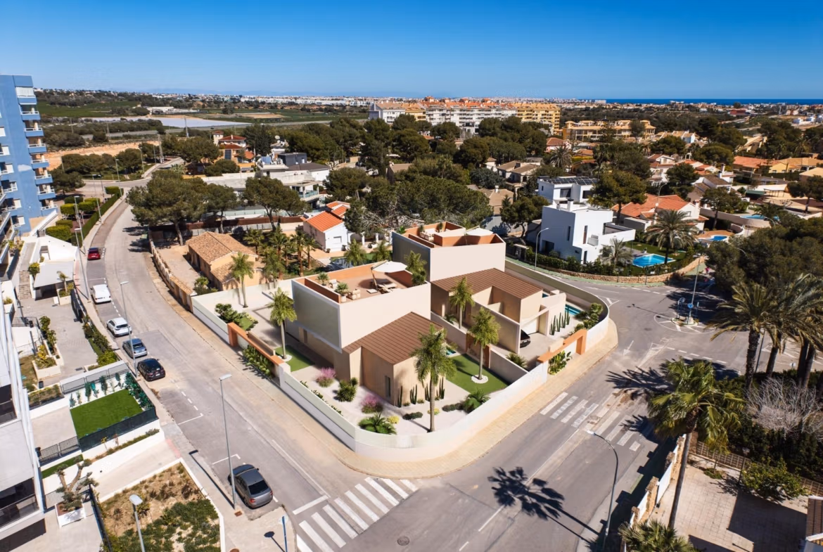 Luxury-New-Build-Villas-with-Sea-Views-in-Dehesa-de-Campoamor-Costa-Blanca-South-12 Modern spacious 4-bedroom villa exterior with landscaped garden and panoramic sea views in Dehesa de Campoamor.