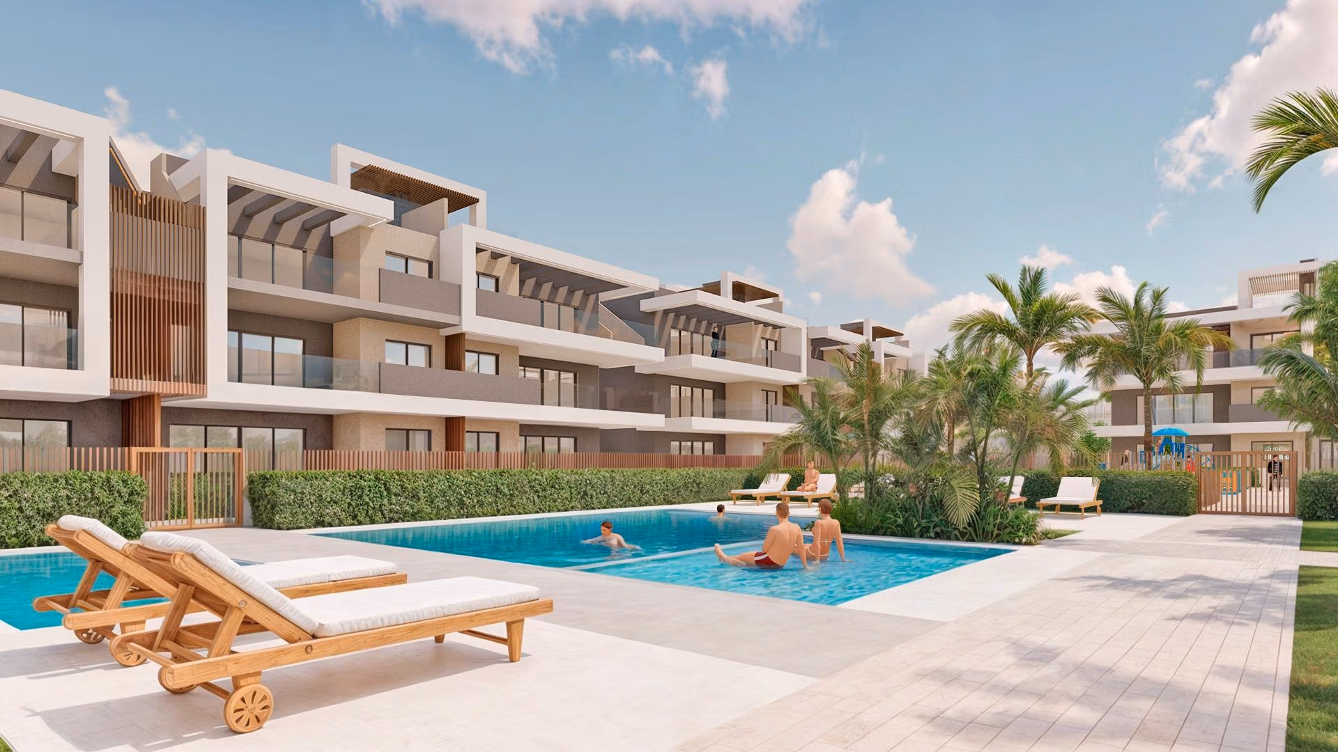 Spacious sun-drenched pool area with modern loungers and landscaped gardens at exclusive Torre de la Horadada 3-bedroom penthouse Phase 2