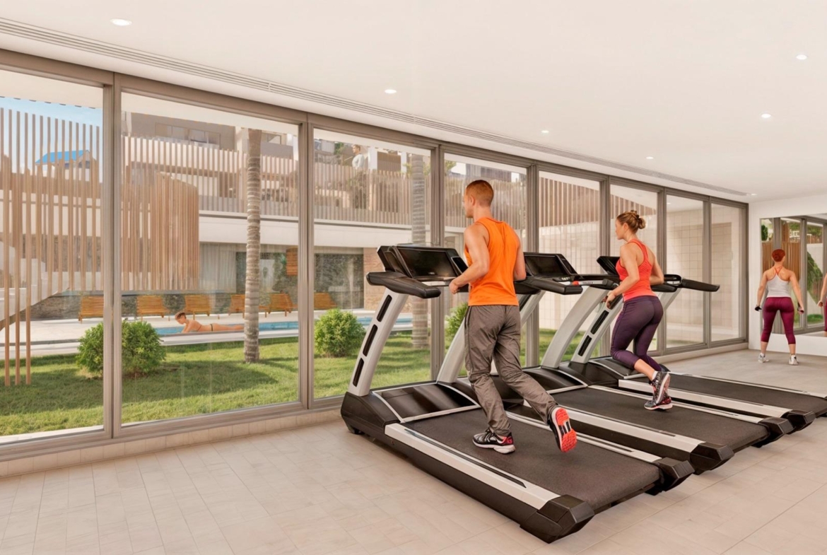 Modern, bright gym with floor-to-ceiling windows in a spacious new build 3-bedroom apartment in Torre de la Horadada.