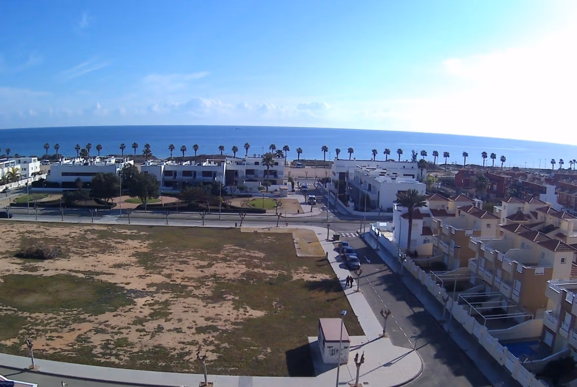 Panoramic sea view from spacious large terrace of modern 3 bedroom apartment in Torre de la Horadada, steps from the beach.