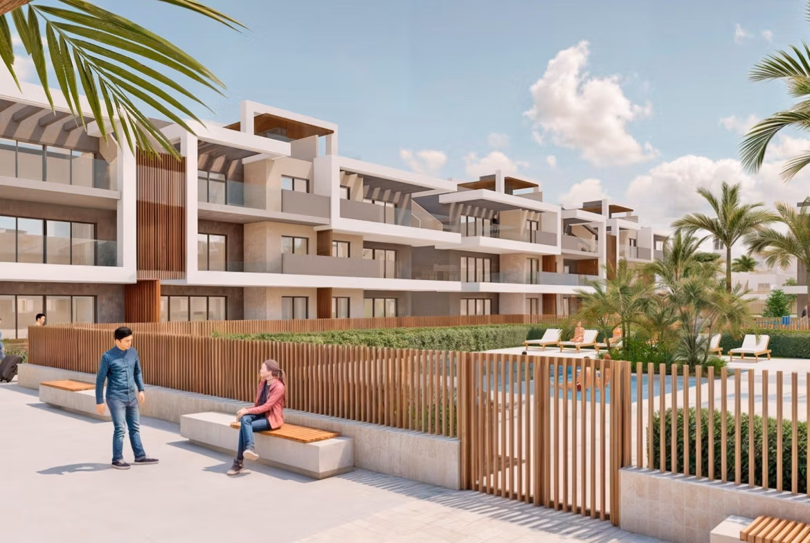 Modern luxury penthouse complex exterior with landscaped courtyard and palm trees in Torre de la Horadada Phase 2