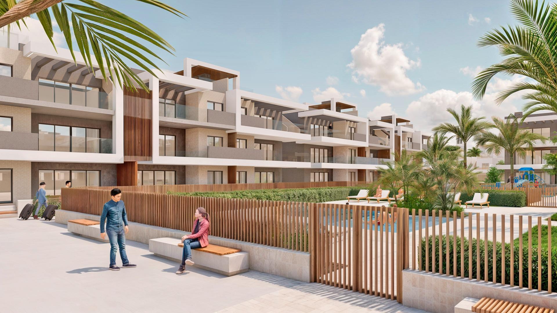 Modern luxury penthouse complex exterior with landscaped courtyard and palm trees in Torre de la Horadada Phase 2