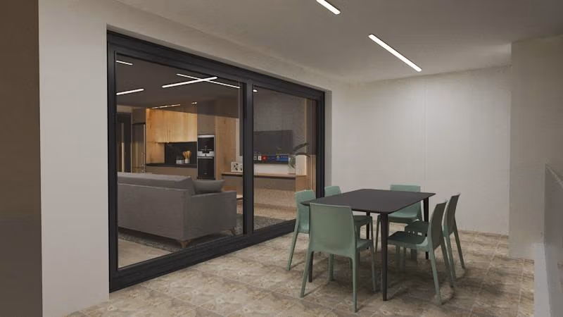 Spacious modern covered terrace with sleek dining area and view into elegant open-plan kitchen in Torre de la Horadada penthouse Phase 2