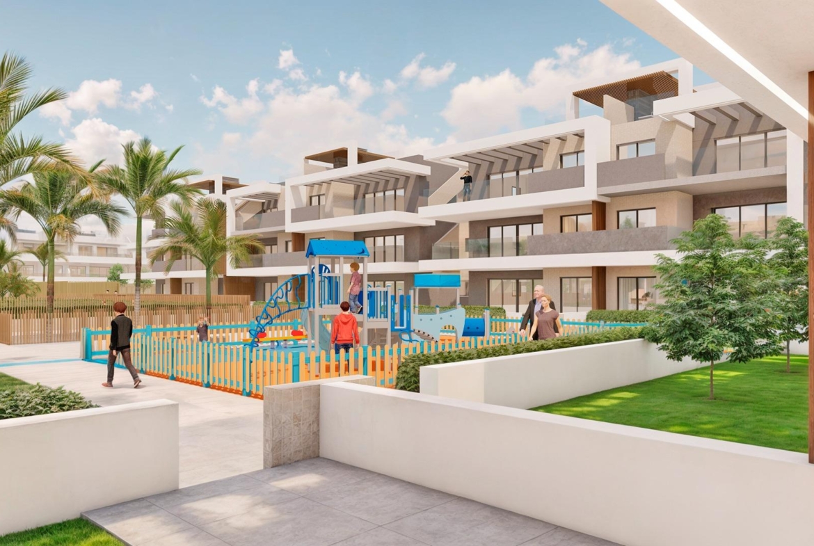 Modern 3-bedroom apartment complex with landscaped gardens, children's play area, and terraces in Torre de la Horadada near the beach.