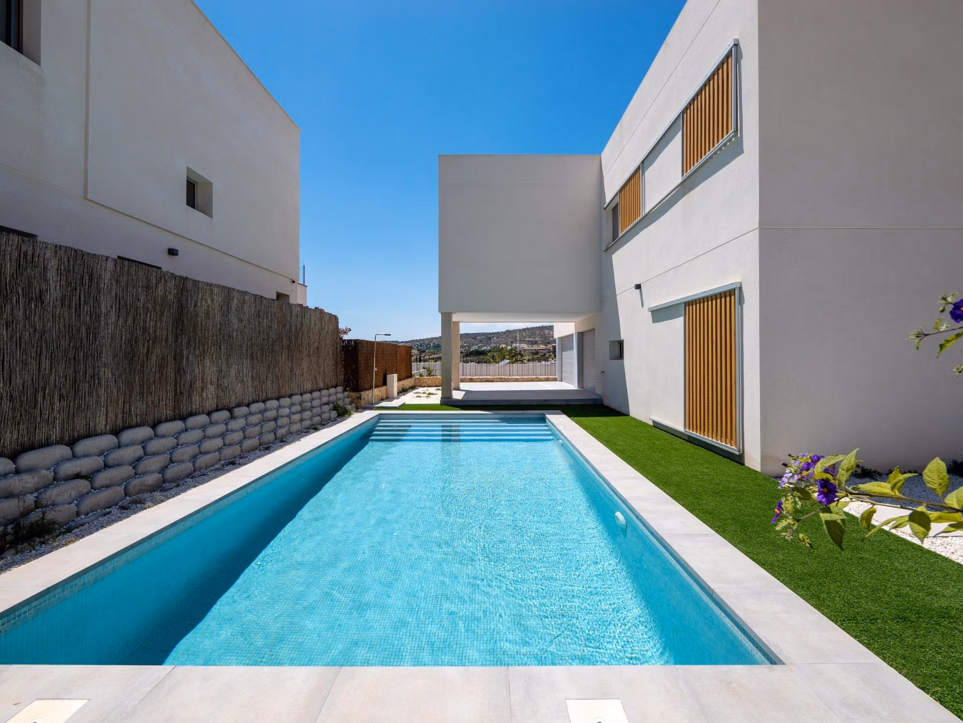 Spacious private pool area with sun-drenched terrace at modern 4-bedroom villa in Algorfa, La Finca with serene golf views.