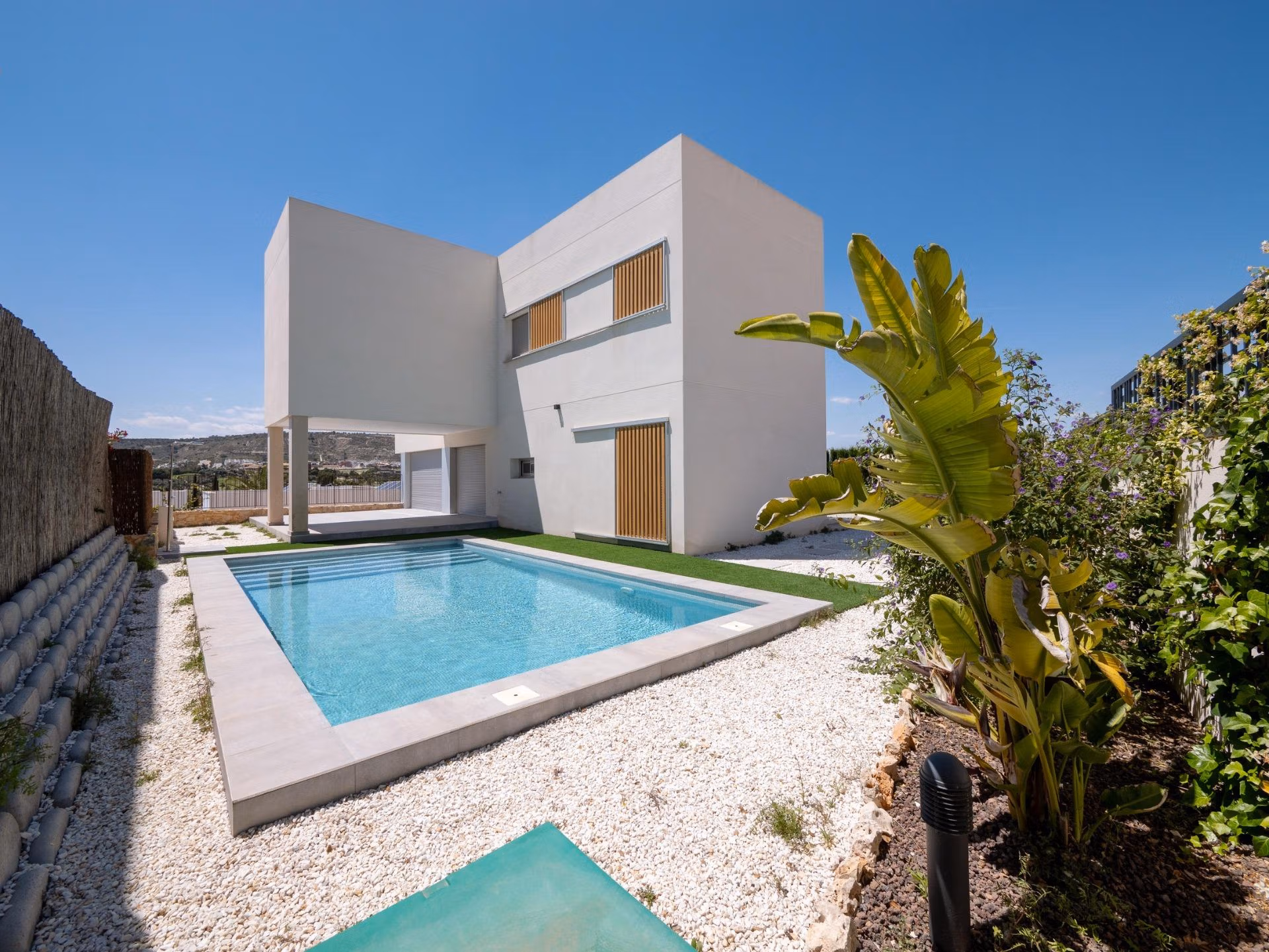 Modern sun-drenched 4-bedroom villa in Algorfa with pristine private pool and minimalist landscaped garden with golf views