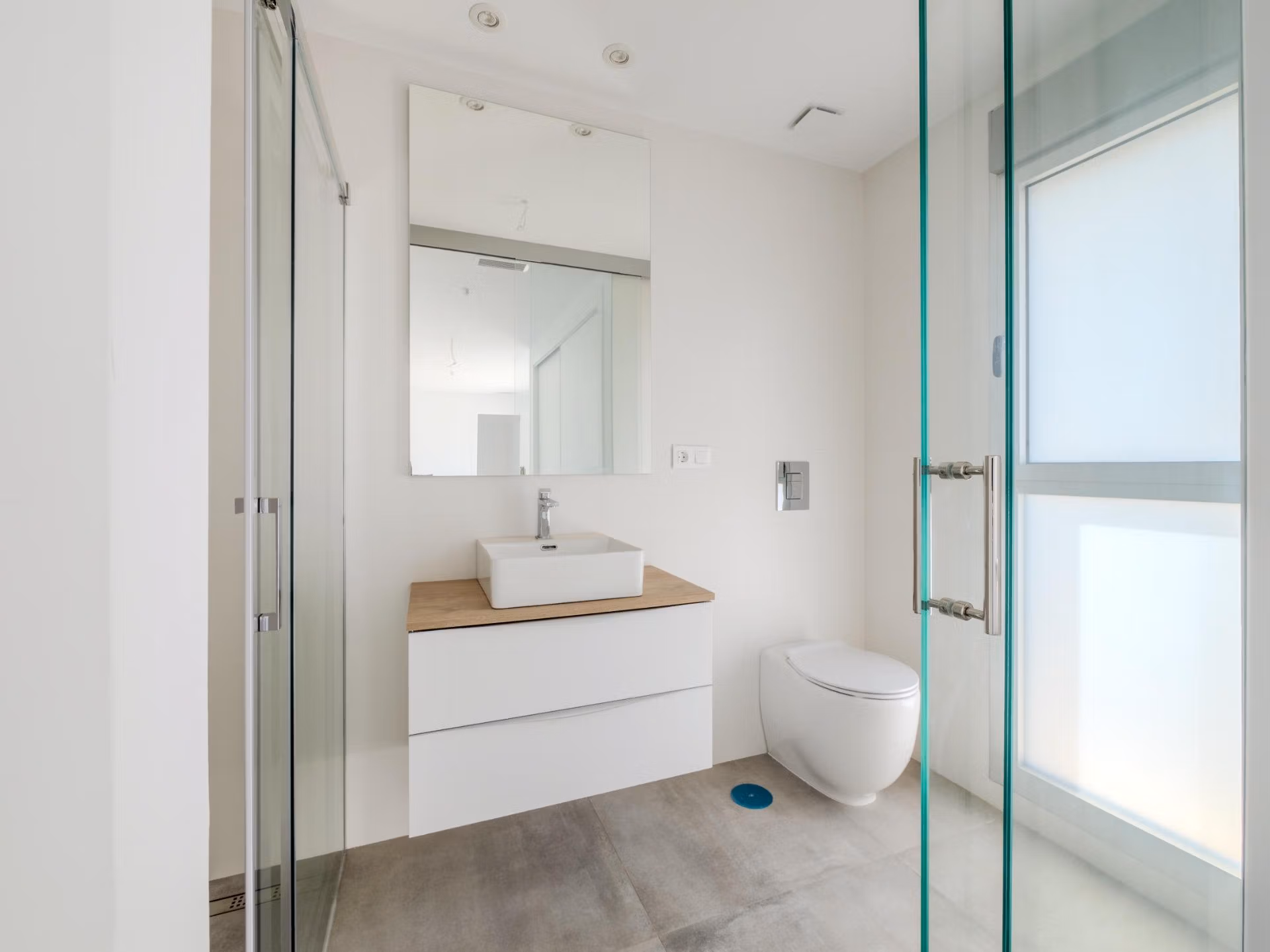 Bright, modern bathroom with sleek fixtures and frosted window in luxury 4-bedroom villa in Algorfa, La Finca.