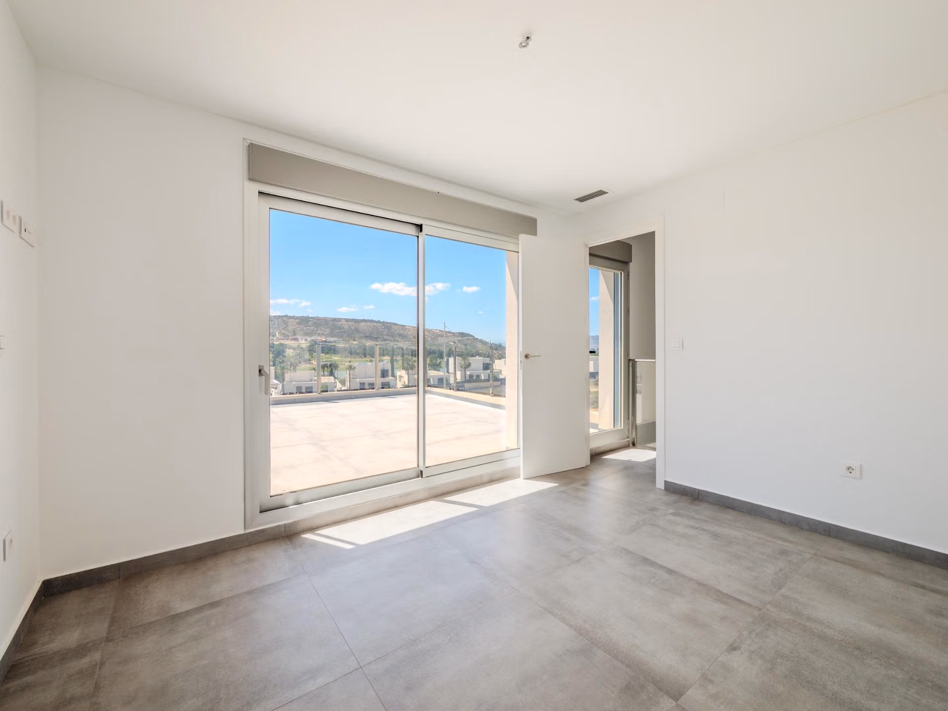 Bright, spacious bedroom with large sliding glass doors and panoramic golf views in luxury 4-bedroom villa, Algorfa, La Finca.