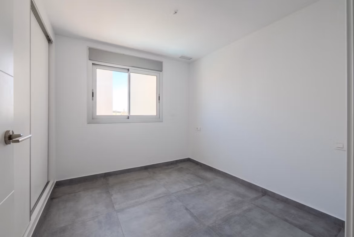 Bright minimalist bedroom with sleek tiled flooring in a contemporary 4-bedroom villa in Algorfa, La Finca