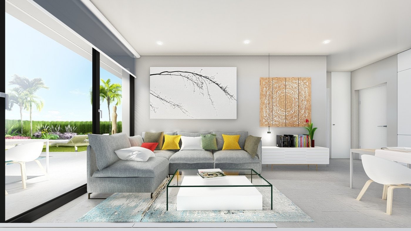Bright, modern living room with sleek furniture and views of lush garden terrace in a charming 2-bedroom villa in Calasparra, Murcia.