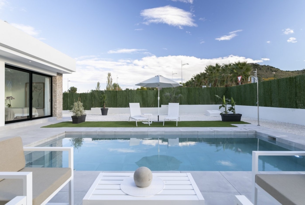 Modern spacious 3-bedroom villa in Calasparra with a private sun-drenched pool and sleek outdoor terrace under a bright sky