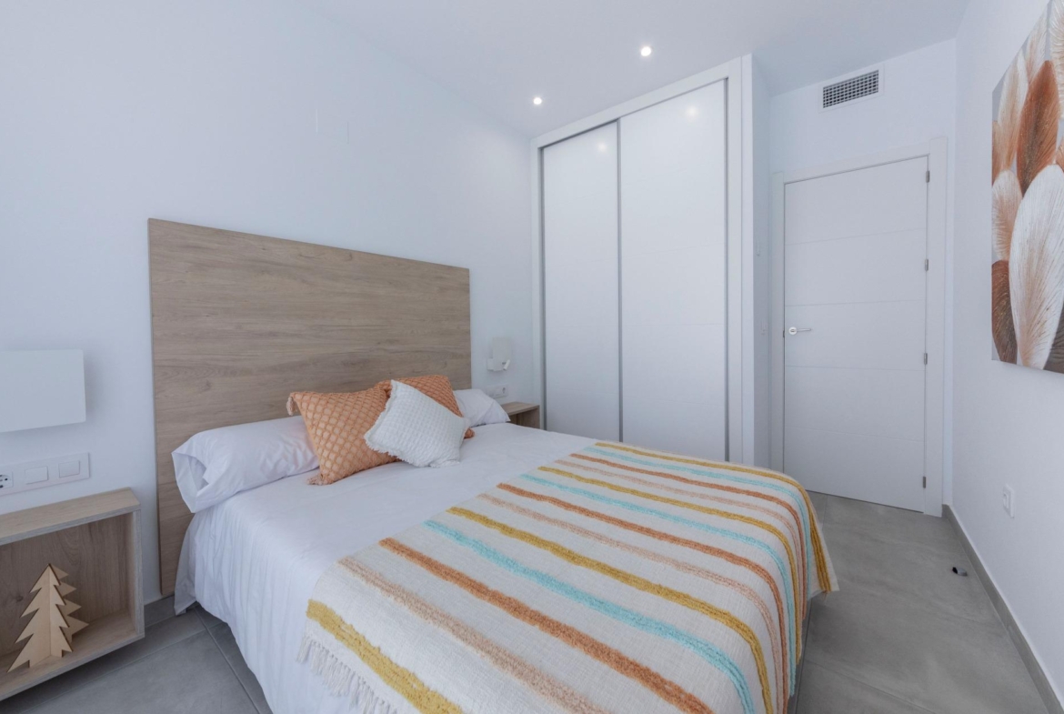 Bright, modern bedroom with minimalist decor in a stylish 3-bedroom villa in Calasparra, Murcia.