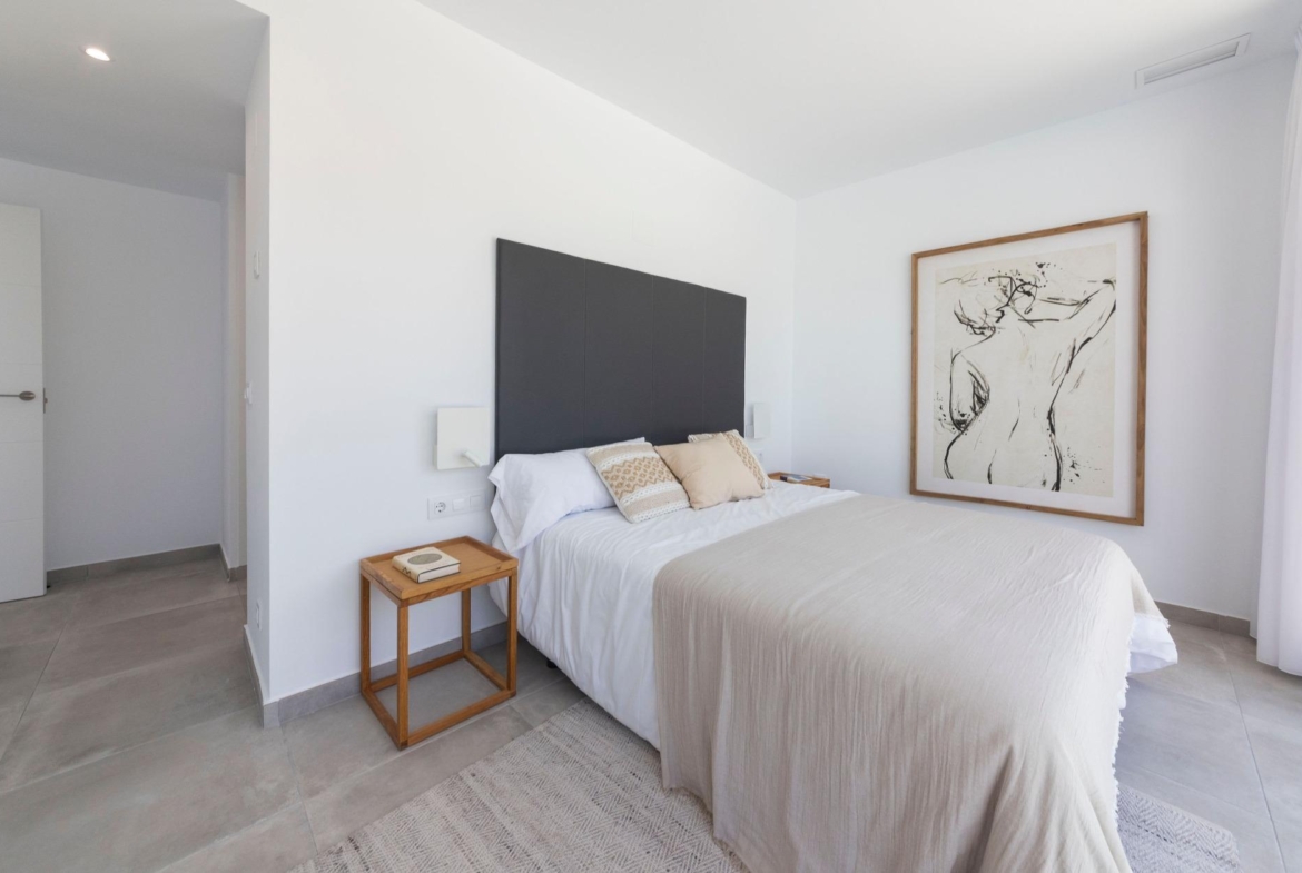 Bright, modern 3-bedroom villa bedroom in Calasparra, Murcia, featuring minimalist decor and elegant neutral tones.