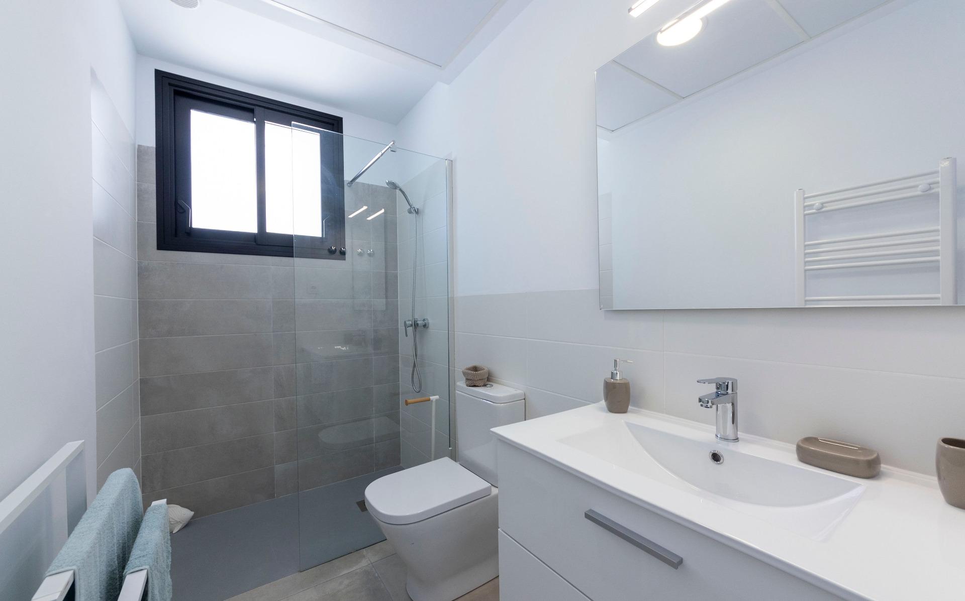 Bright modern bathroom with sleek fixtures and walk-in shower in luxury 3 bedroom villa in Calasparra, Murcia