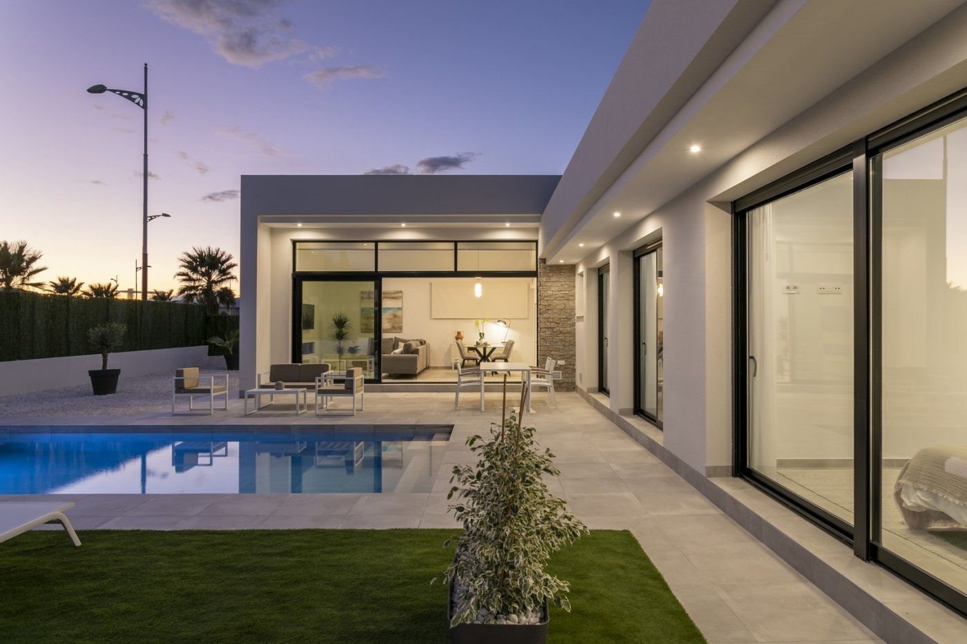 Elegant new build 3-bedroom villa in Calasparra with spacious terrace and private pool under a twilight sky.