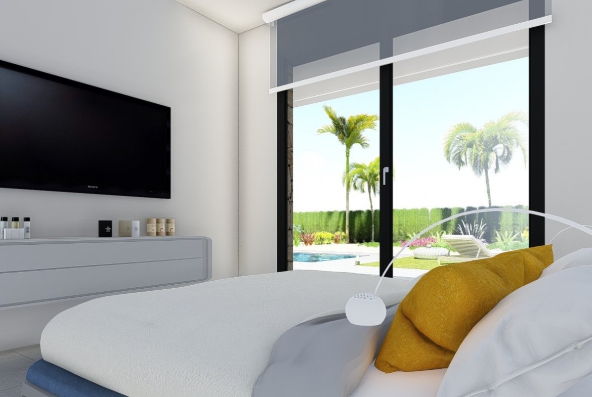 Bright modern bedroom with large glass doors opening to a landscaped garden and private pool in a New Build 2 Bedroom Villa, Calasparra.