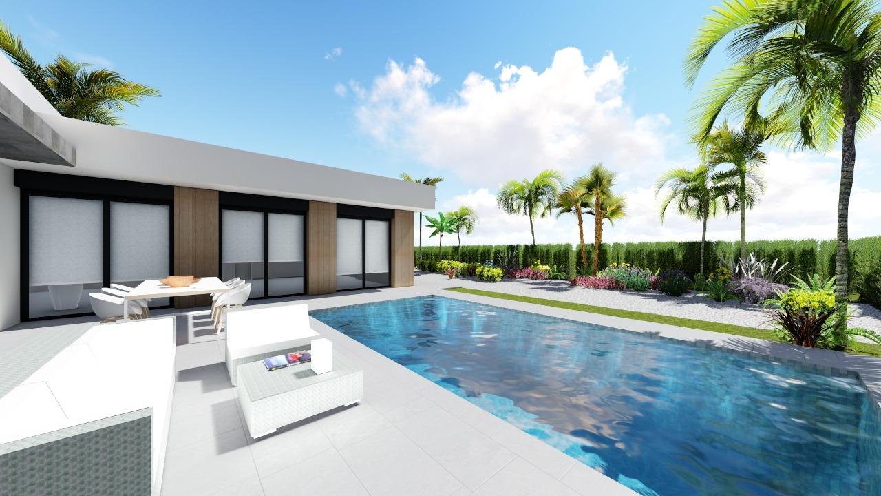 Spacious private pool and sun-drenched terrace of modern 3-bedroom villa with landscaped garden in Calasparra, Murcia.