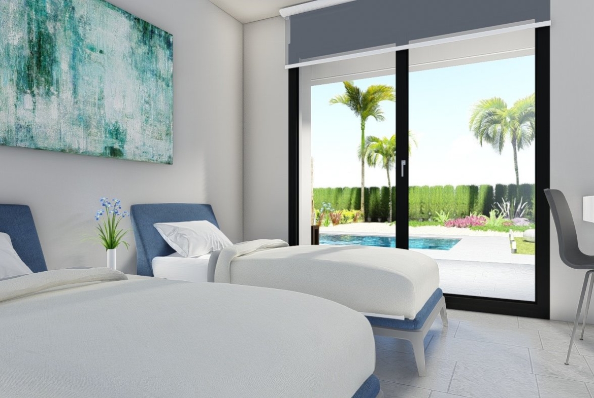 Bright, modern 2-bedroom villa bedroom in Calasparra, Murcia with sliding doors opening to a private pool and landscaped garden.