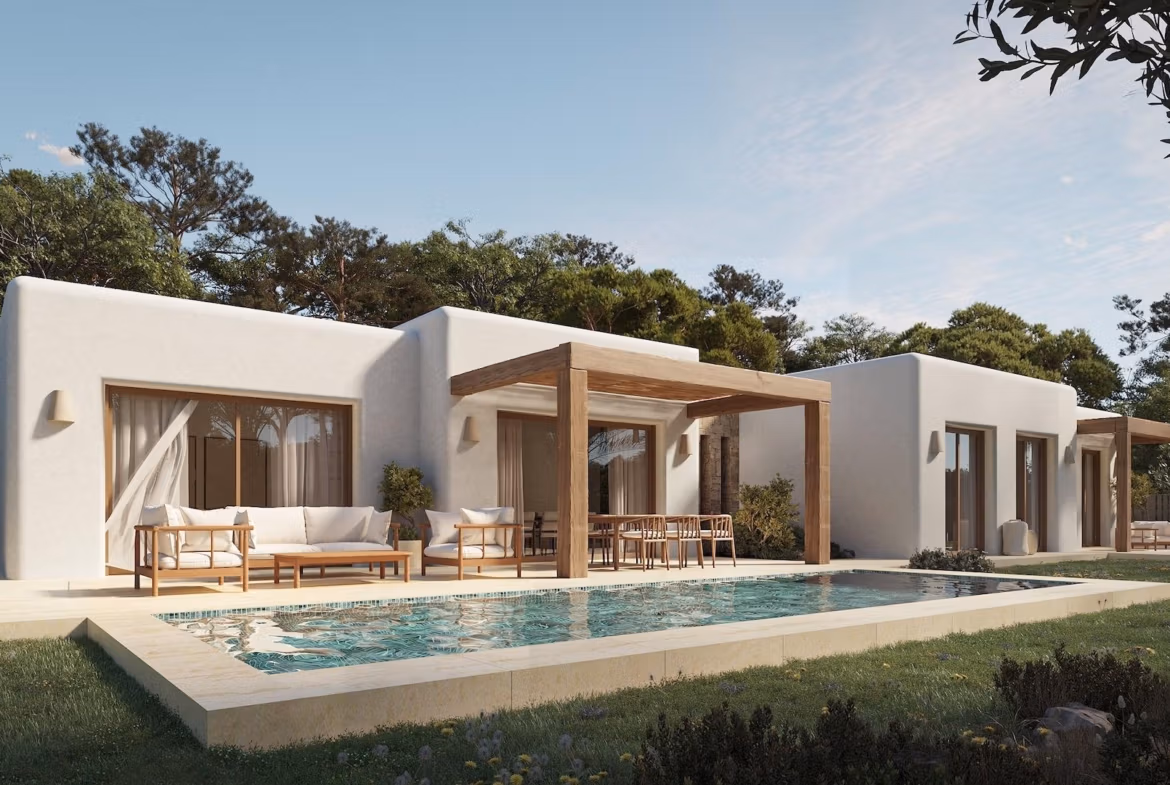 Sun-drenched Ibizan-style single-storey villa in La Fustera, Benissa, with a sleek pool, spacious terrace, and natural wood pergola.