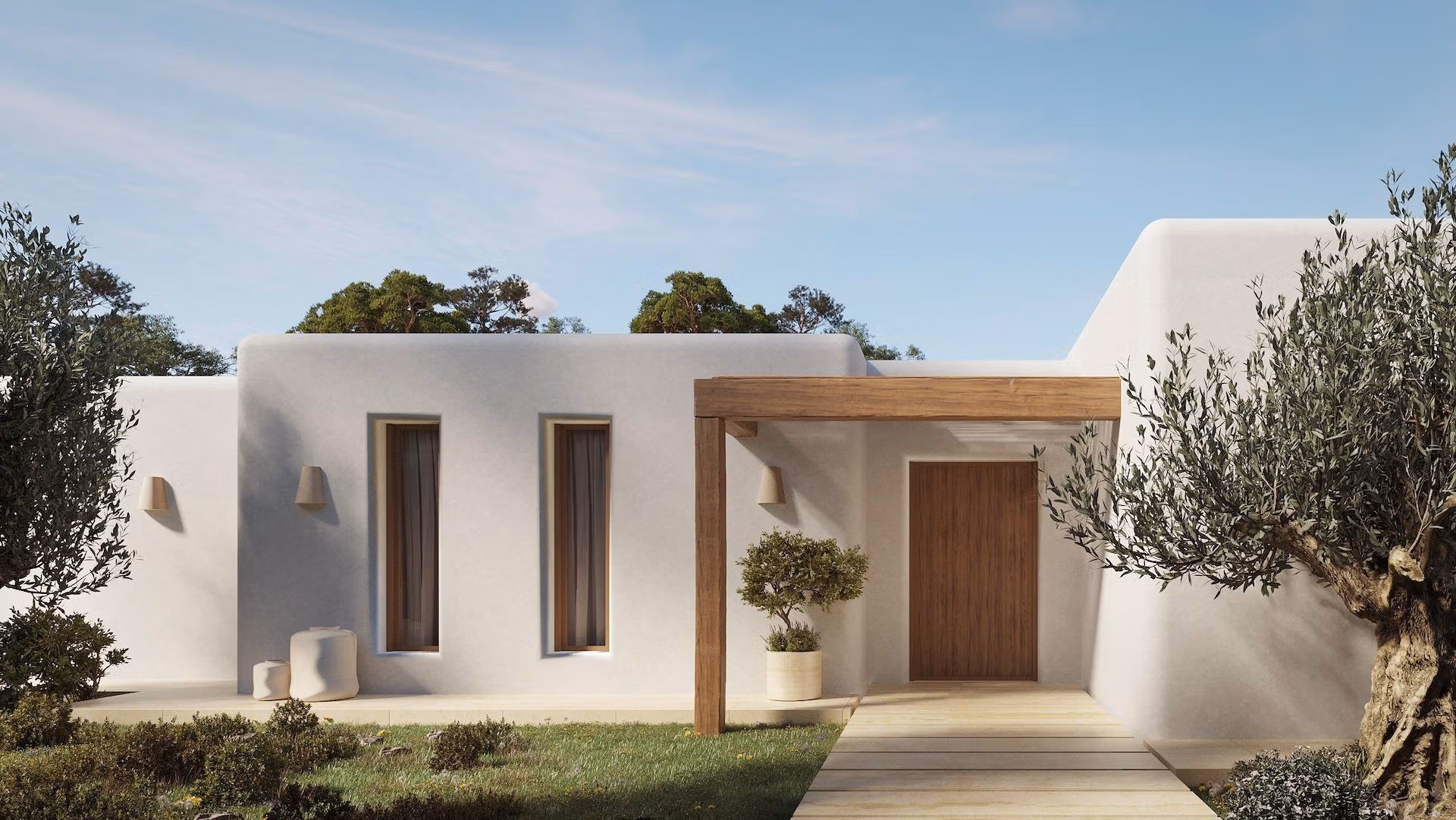Elegant Ibizan-style single-storey villa entrance in La Fustera, Benissa, featuring smooth white walls and natural wooden accents.
