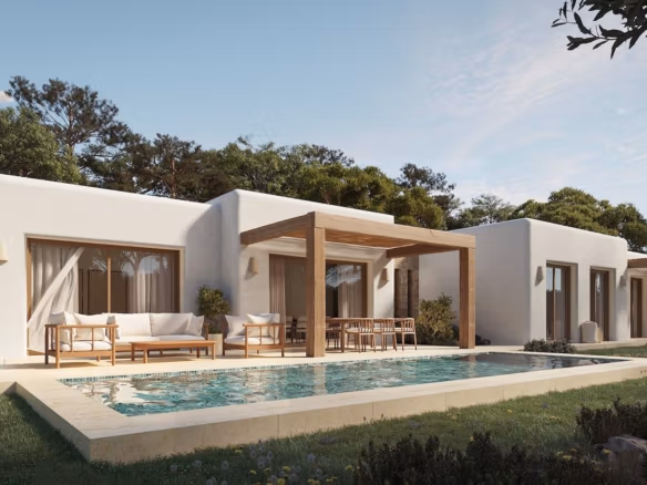 Sun-drenched Ibizan-style single-storey villa in La Fustera, Benissa, with a sleek pool, spacious terrace, and natural wood pergola.