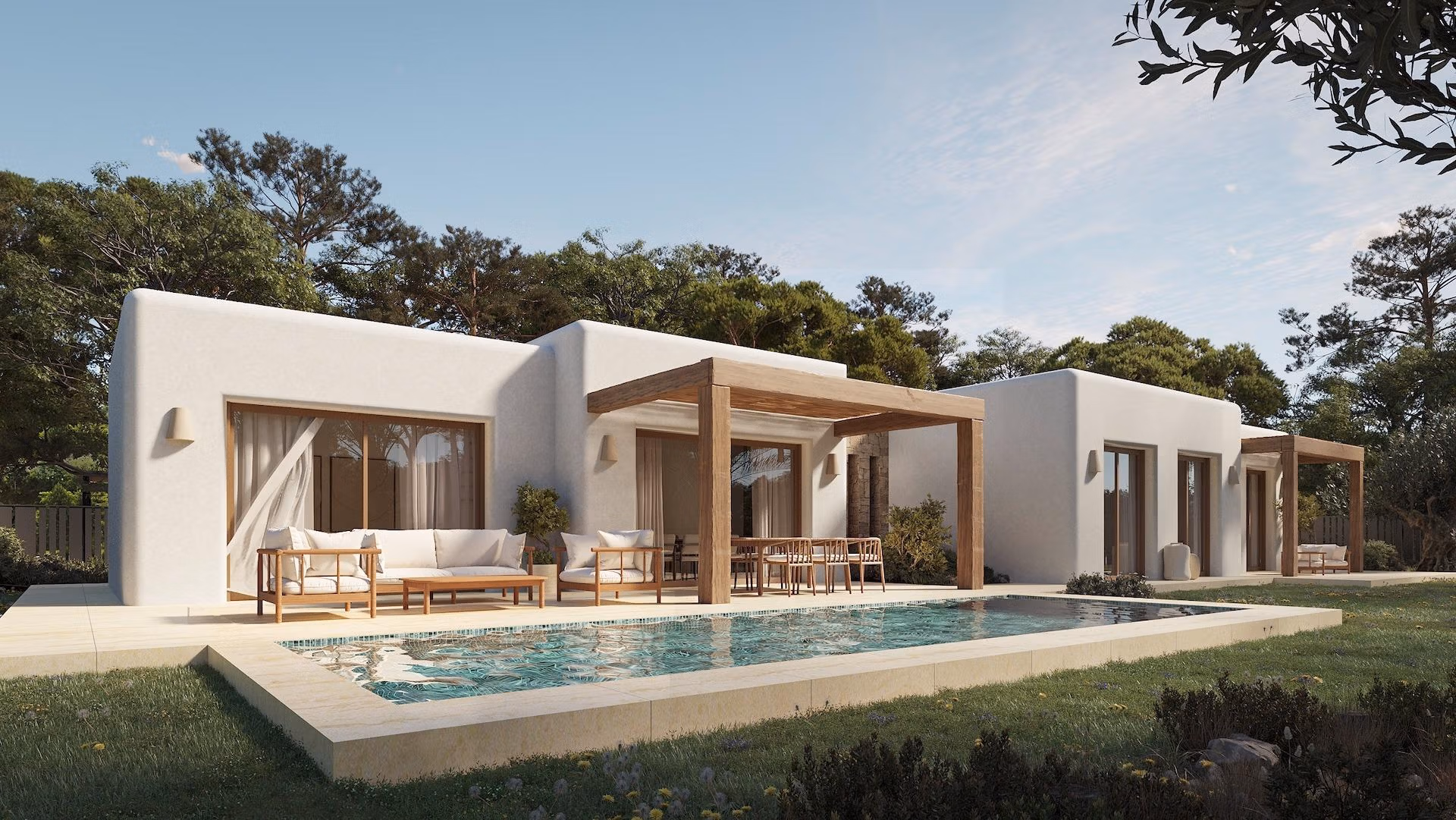 Sun-drenched Ibizan-style single-storey villa in La Fustera, Benissa, with a sleek pool, spacious terrace, and natural wood pergola.