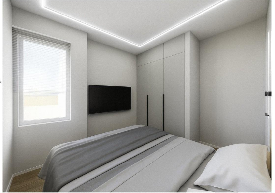 Bright, modern bedroom in elevated 2-bedroom penthouse near Playa El Acequión, Torrevieja, featuring sleek built-in wardrobes and natural light.