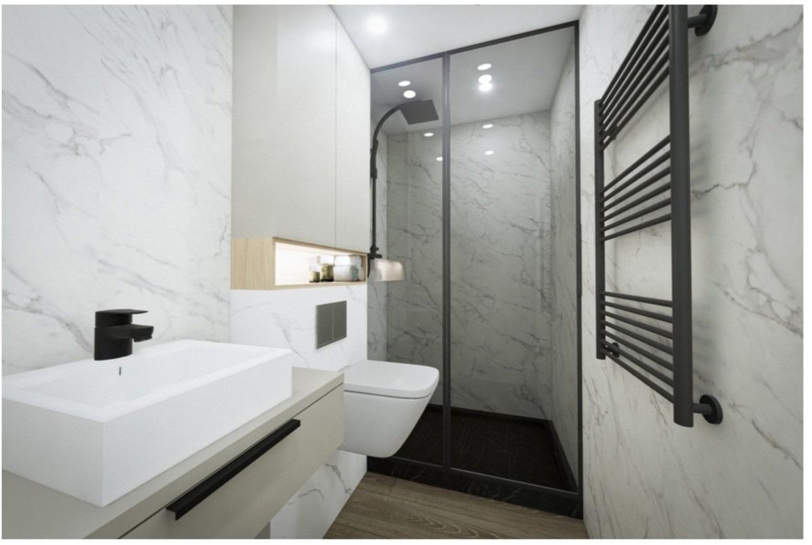 Sleek modern bathroom with marble walls and walk-in shower in a luxury 2 bedroom Torrevieja apartment near Playa El Acequión