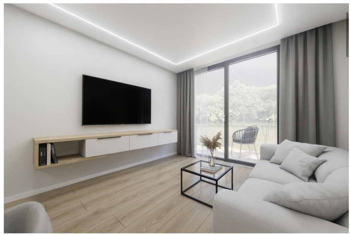 Bright modern living room with sleek TV unit and glass door opening to terrace in 2-bedroom apartment, Torrevieja.
