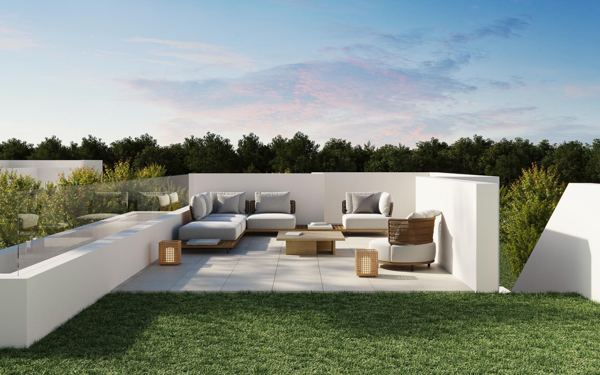 Elegant outdoor lounge with modern seating and glass railing overlooking lush greenery at luxury 5-bedroom villa in Polop de la Marina.