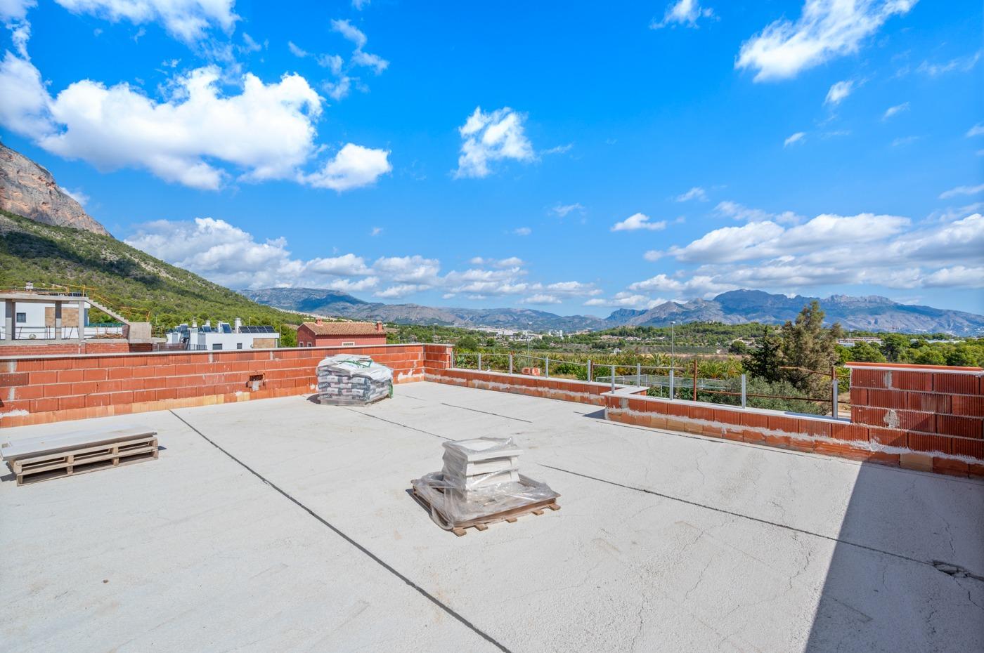 Spacious sunlit terrace with panoramic mountain and sea views in a luxury 5-bedroom villa in Polop de la Marina