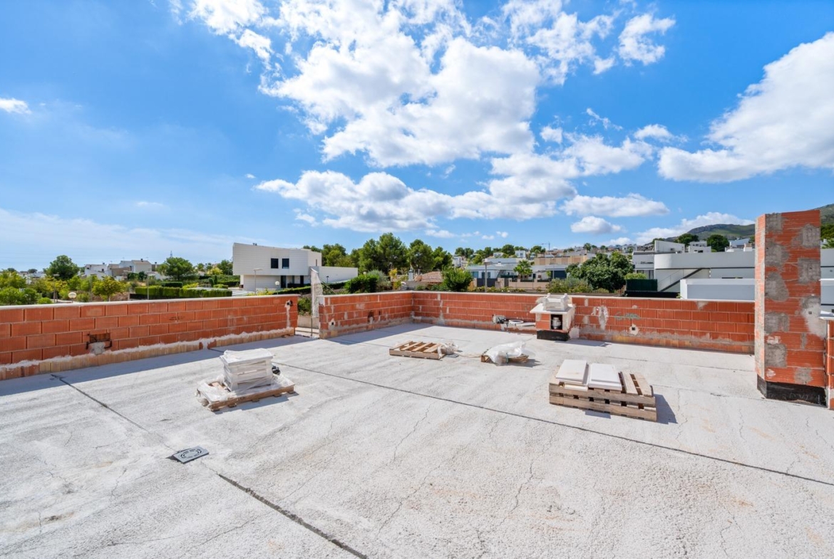 Unfinished spacious rooftop terrace with panoramic mountain views at luxury 5 bedroom villa in Polop de la Marina