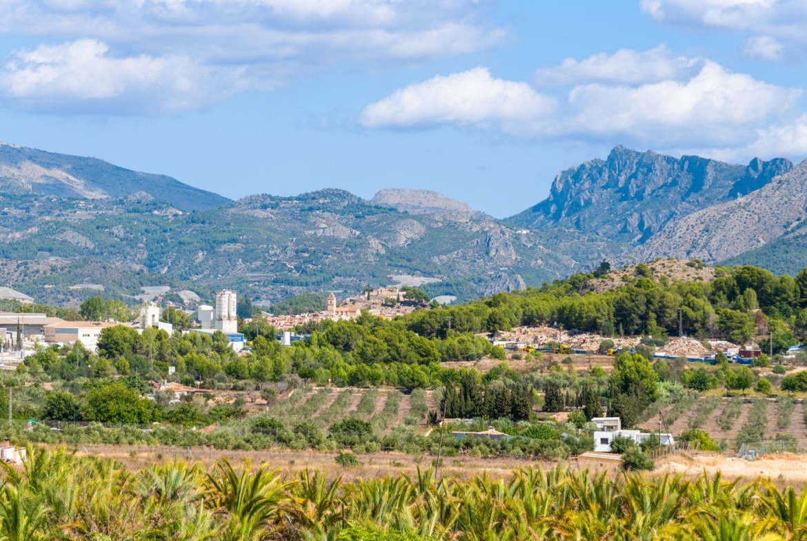 Panoramic mountain and sea views from the grounds of a spacious luxury 5-bedroom villa in Polop de la Marina.