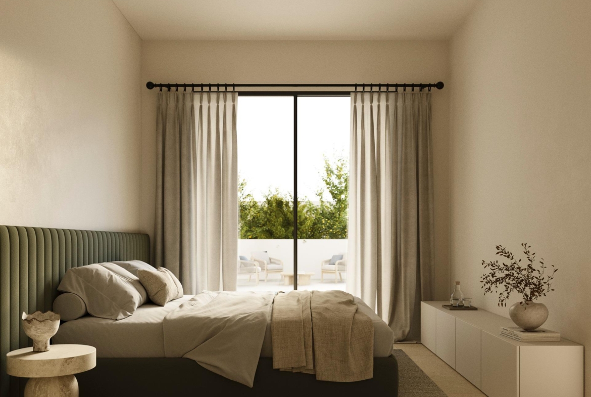 Sunlit elegant bedroom with plush bed, soft curtains, and terrace seating in luxury 5-bedroom villa in Polop de la Marina