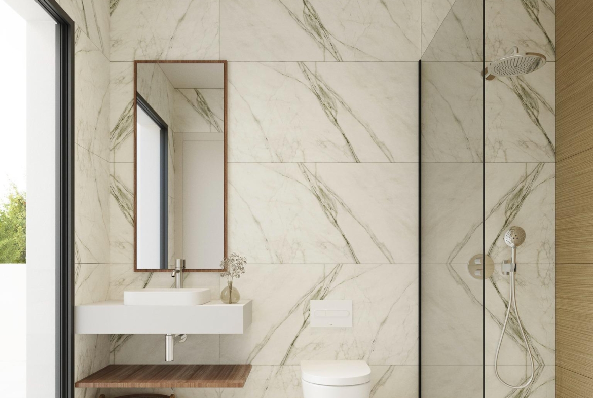 Bright modern bathroom with marble walls and walk-in shower in spacious luxury 5 bedroom villa in Polop de la Marina