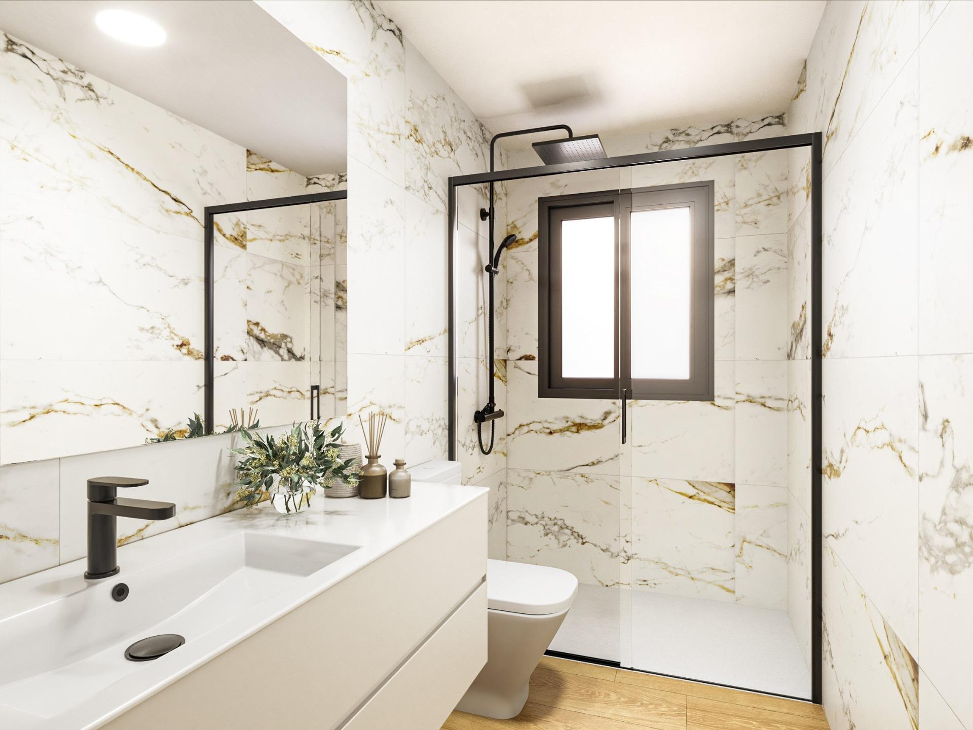Modern luxury bathroom with sleek black fixtures and marble walls in exclusive 2-bedroom penthouse in Torrevieja.