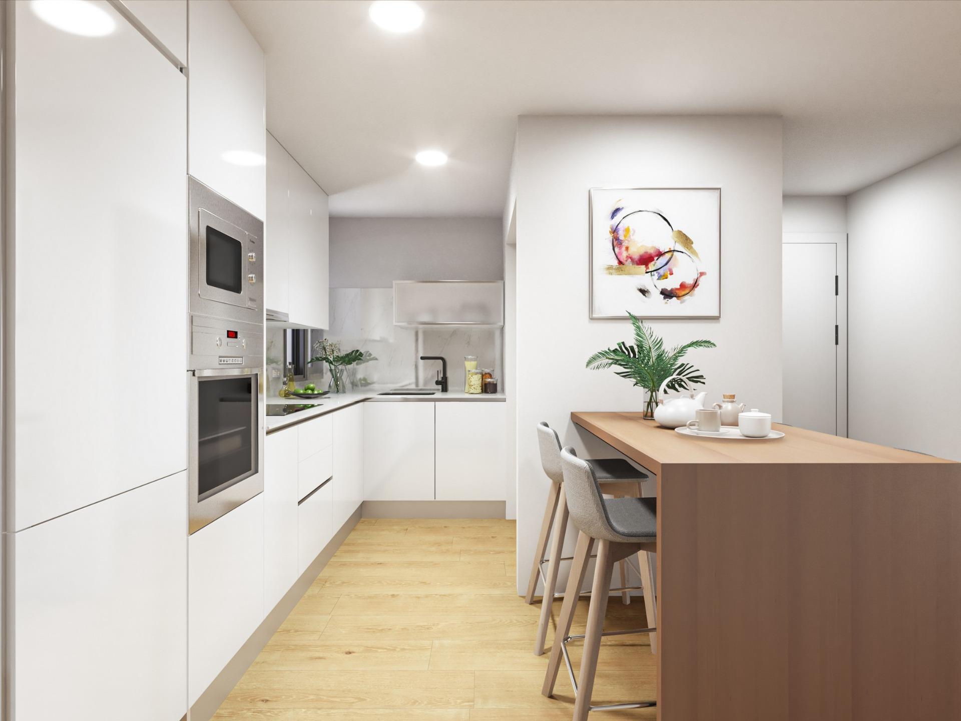 Modern sleek kitchen with white cabinetry and wooden breakfast bar in stylish 2-bedroom apartment in Torrevieja