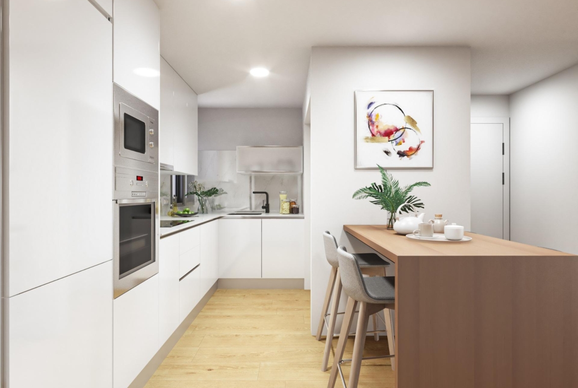 Bright modern open-plan kitchen and dining area in luxury 2 bedroom ground floor apartment in Torrevieja near Playa del Cura