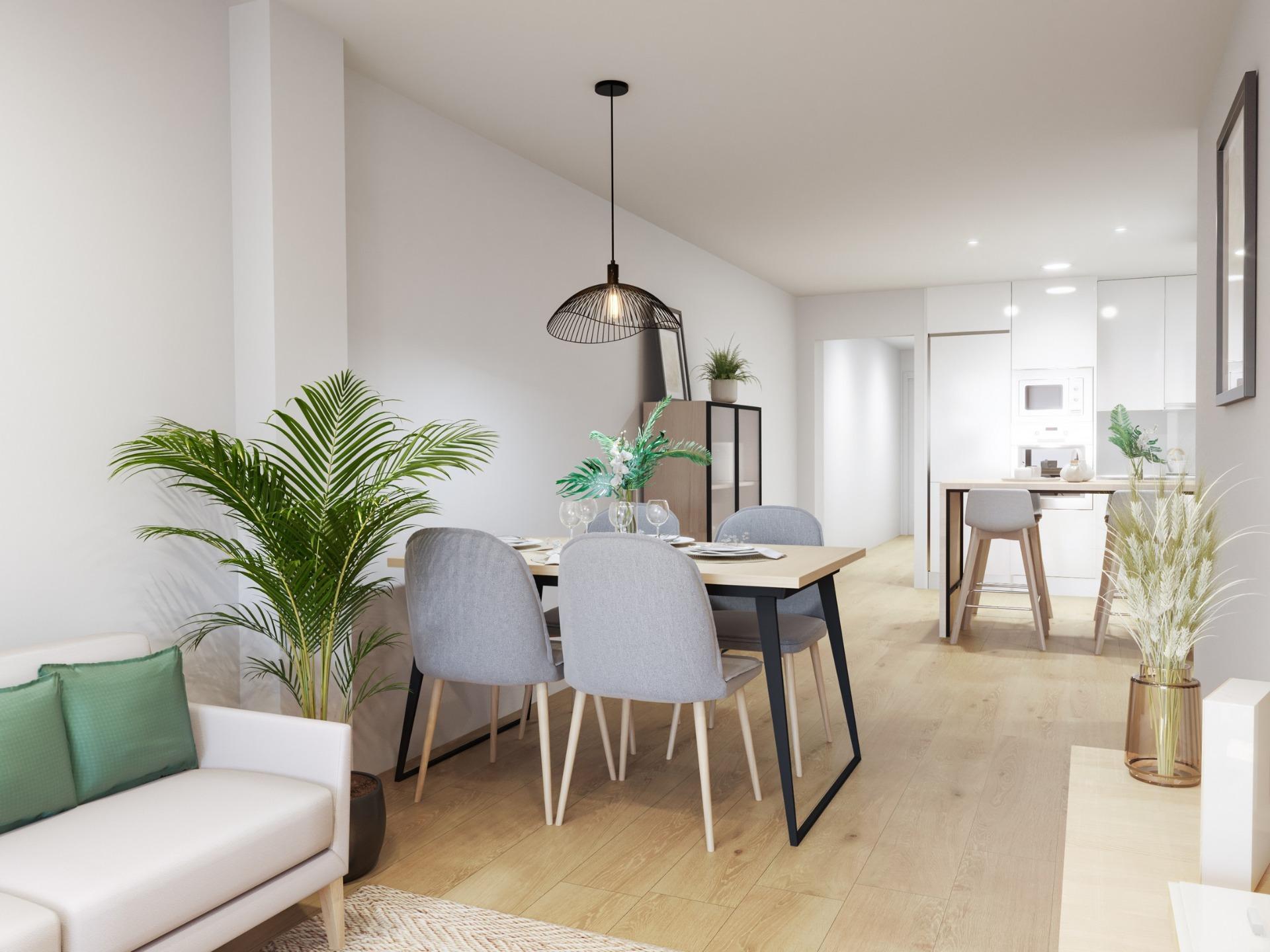Bright modern open-plan dining and kitchen area in stylish new build 2-bedroom apartment in Torrevieja near Playa del Cura