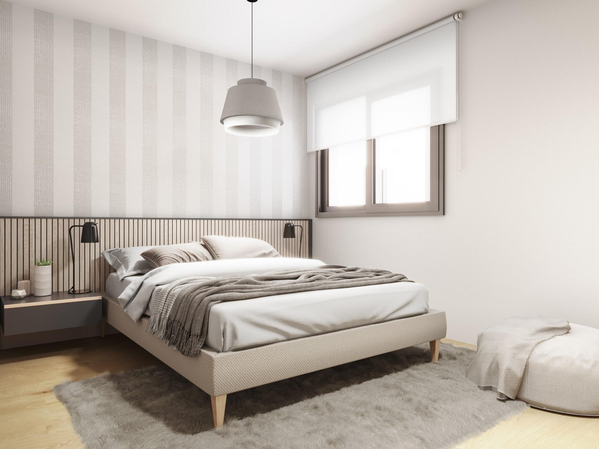 Bright, modern 2-bedroom penthouse bedroom with elegant striped accent wall and soft natural light in Torrevieja.