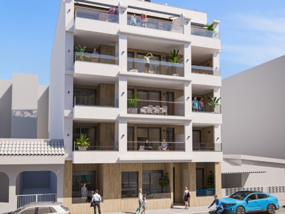 Modern new build 2-bedroom apartment building in Torrevieja with spacious private terraces and sleek contemporary design under clear blue sky.