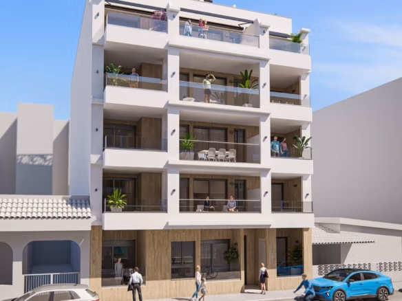 Modern nieuwbouwcomplex met appartementen met 2 slaapkamers, ruime privéterrassen en een strak eigentijds ontwerp onder een heldere blauwe hemel in Torrevieja.