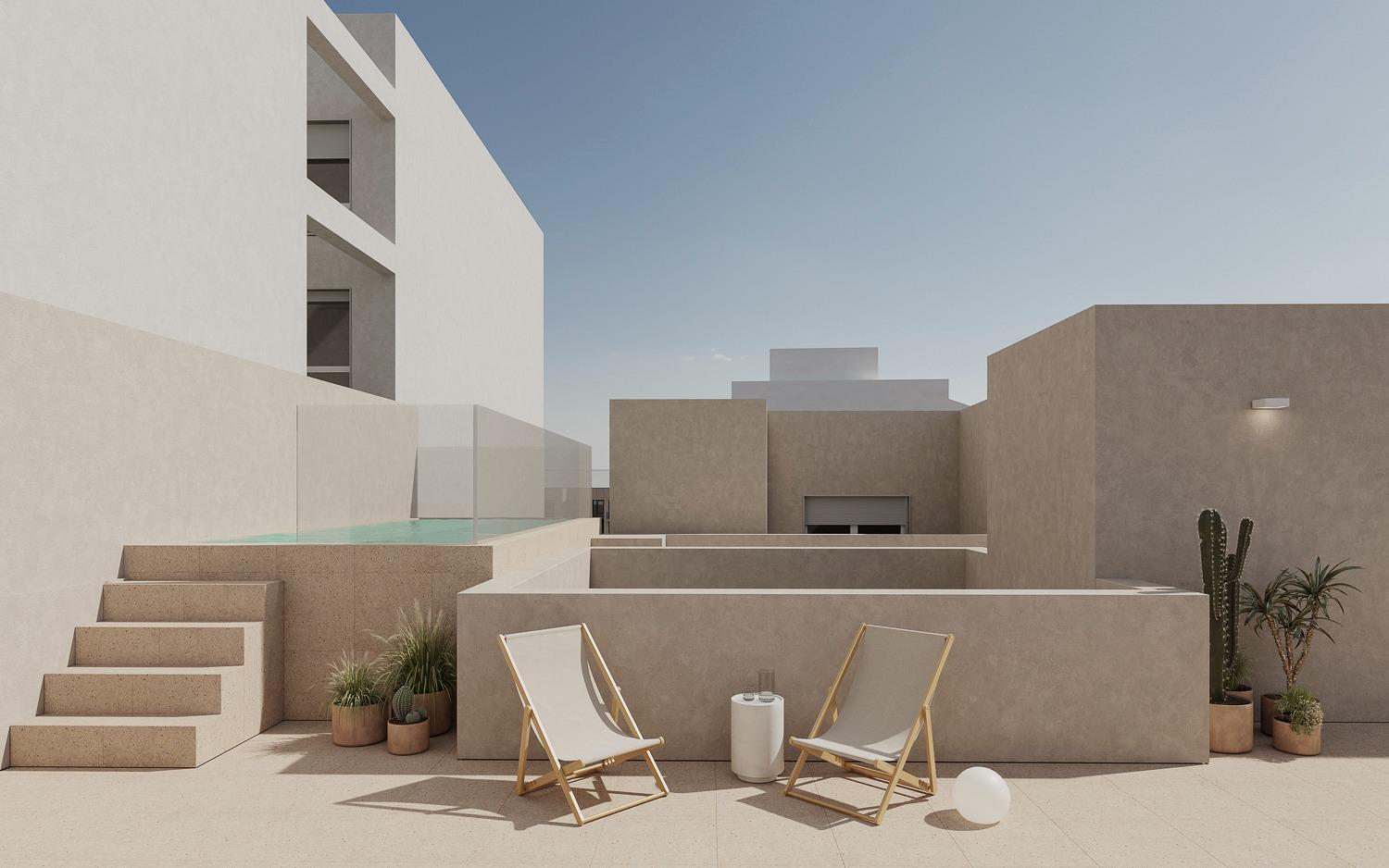 Modern sun-drenched terrace with lounge chairs and raised pool in spacious new build 2-bedroom apartment in central Torrevieja.