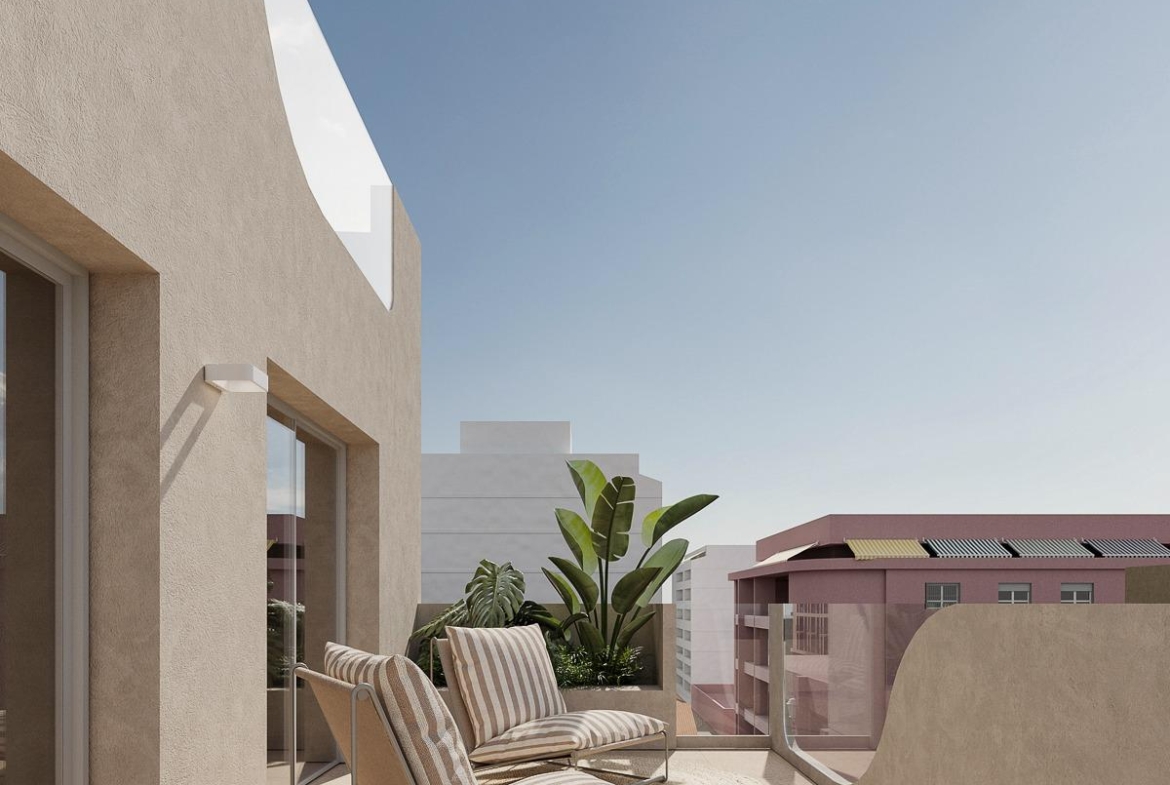 Sun-drenched terrace with modern loungers in spacious 2-bedroom new build apartment in central Torrevieja, near the sea.