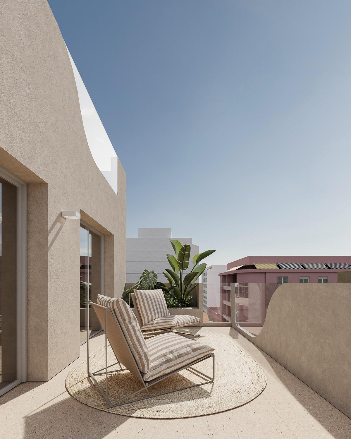Sun-drenched terrace with modern loungers in spacious 2-bedroom new build apartment in central Torrevieja, near the sea.